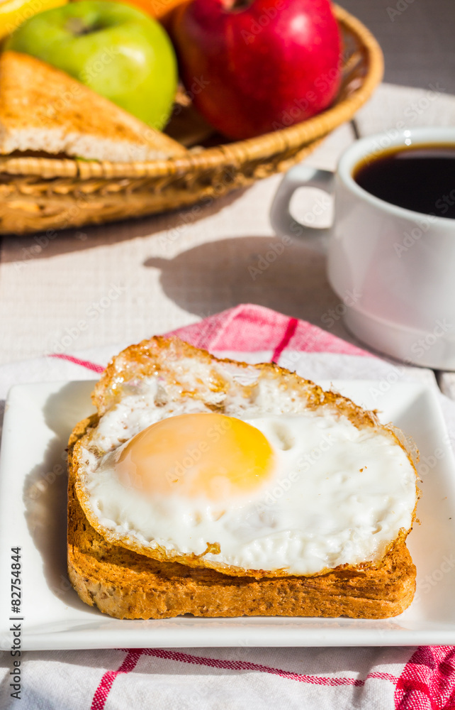 crispy toast with a fried egg and a cup of coffee, fruit, breakf crispy toast with a fried egg and a cup of coffee, fruit, breakf