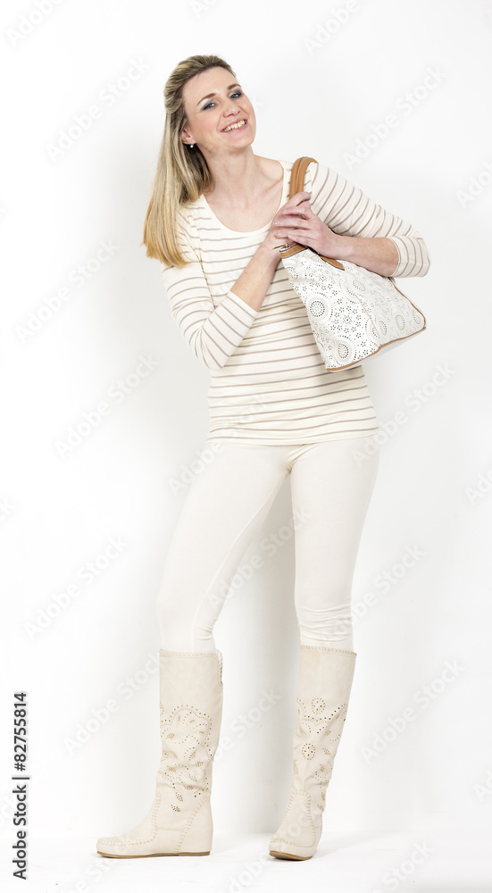 standing woman wearing summer boots with a handbag standing woman wearing summer boots with a handbag