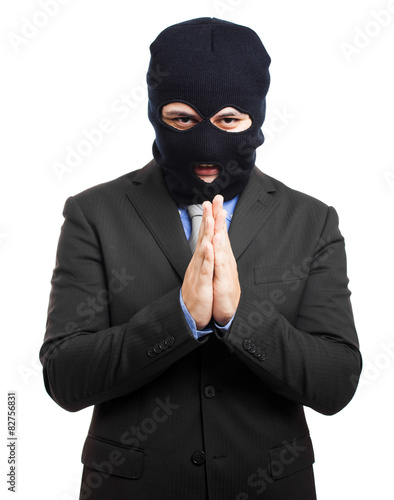 corruption concept : man in business suit and black mask 