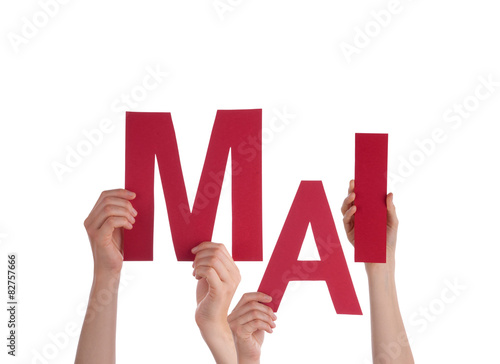 People Holding German Word Mai Means May