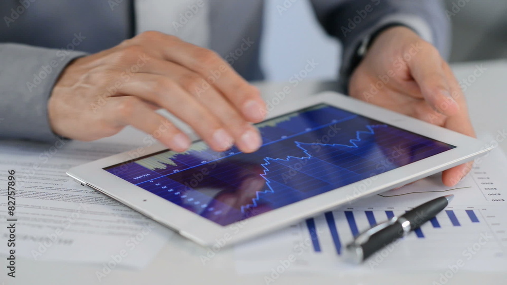 Businessman Analysing Growth With Tablet Businessman Analysing Growth With Tablet