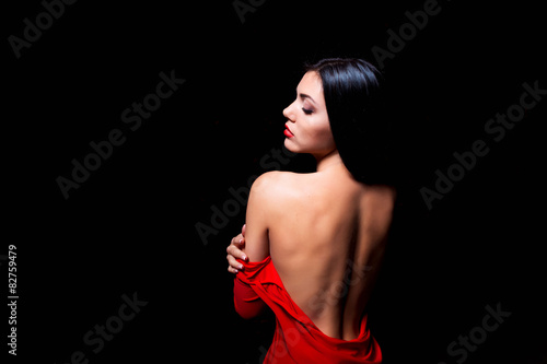 Elegant woman in red dress getting stripped photo