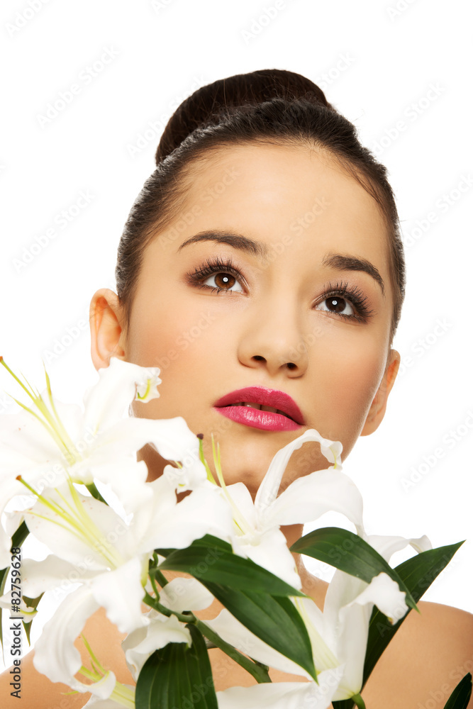 Beauty face of a woman with flower. Beauty face of a woman with flower.