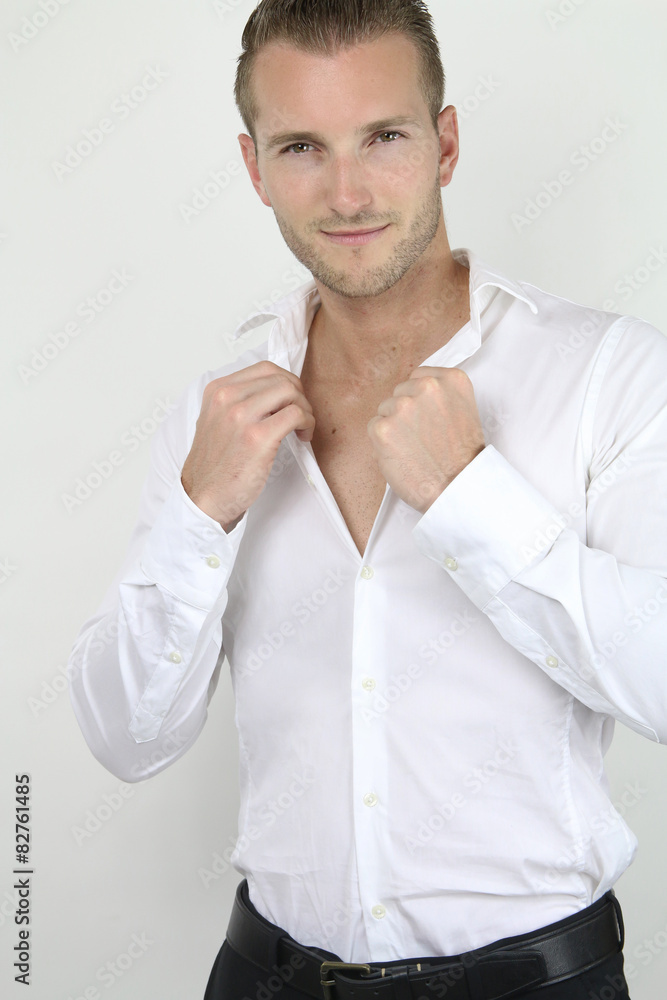 handsome blond man posing on a gray background handsome blond man posing on a gray background