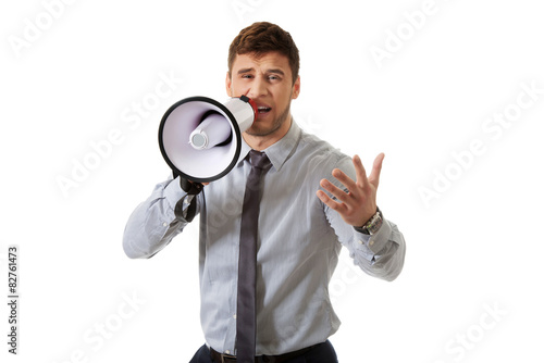 Businessman shouting through megaphone.