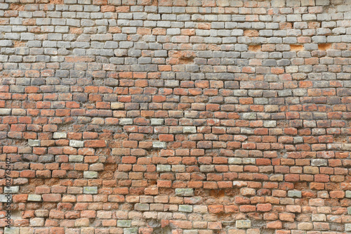 Weathered and damaged brick wall texture background