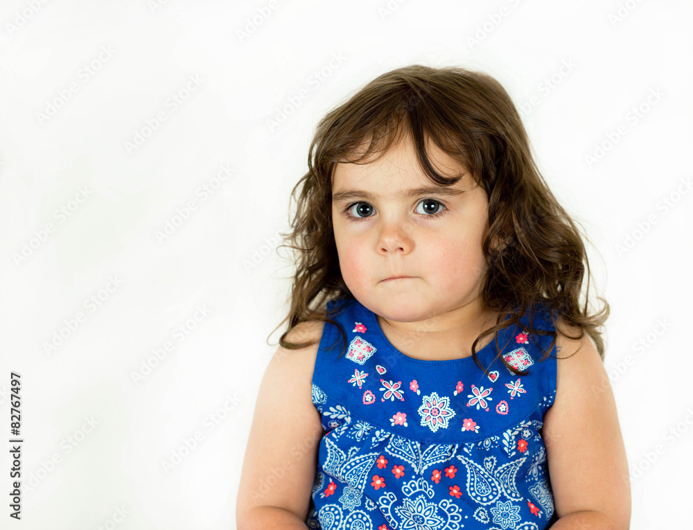 Naklejka premium Beautiful toddler in a flowered dress