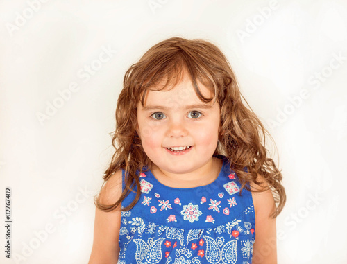 Beautiful toddler in a flowered dress