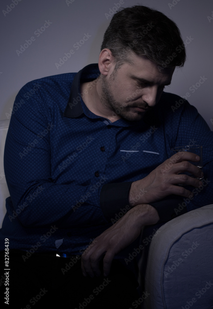 Young alcoholic drinking alone Young alcoholic drinking alone