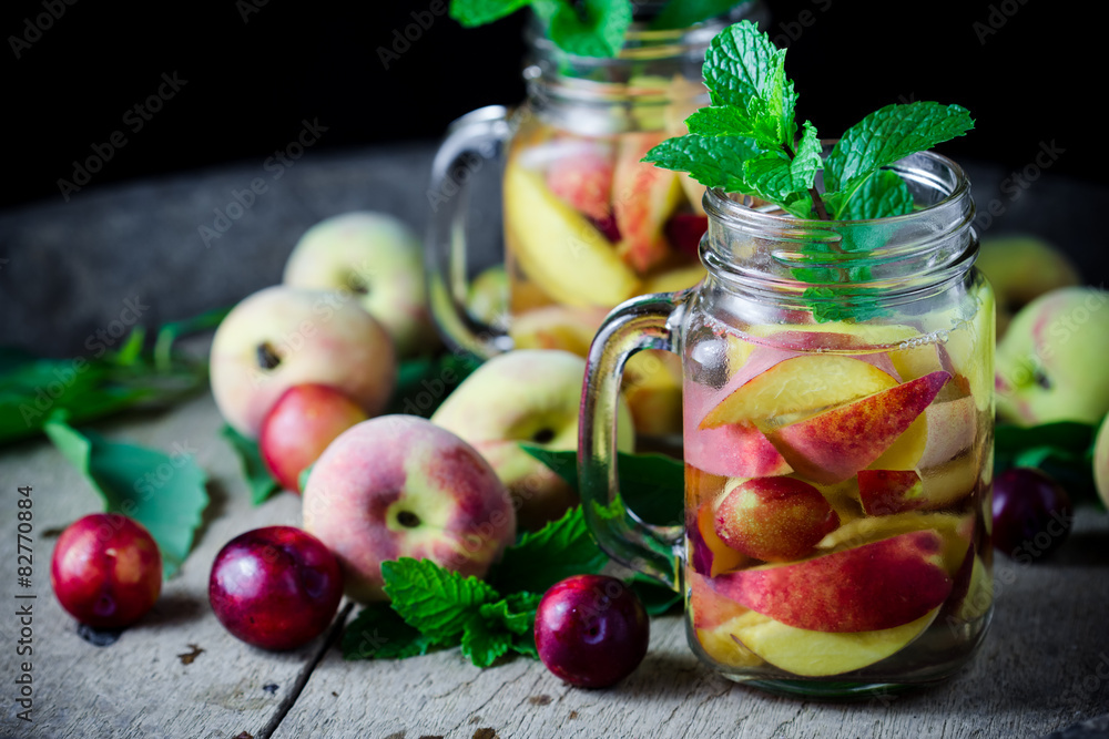 Jar delicious refreshing drink of peach fruits and plum with mi Jar delicious refreshing drink of peach fruits and plum with mi