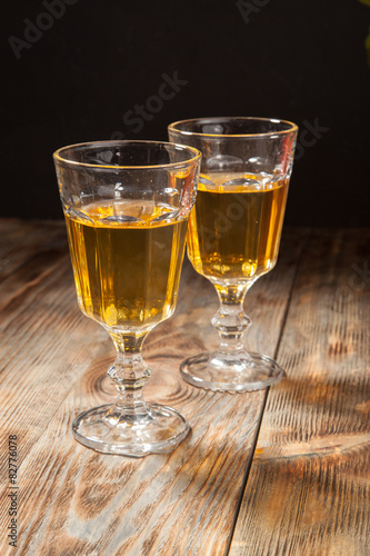 glass of white wine on a wooden table