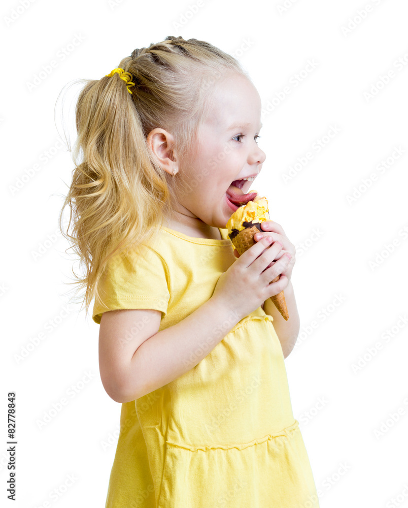 Naklejka premium child eating ice cream in studio isolated