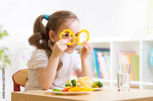 child eating in kindergarten