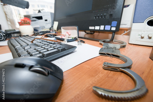 Принти на полотні Handcuffs open paper clip on the table office worker