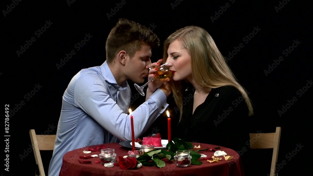 Lovely young couple having romantic dinner in restaurant Lovely young couple having romantic dinner in restaurant