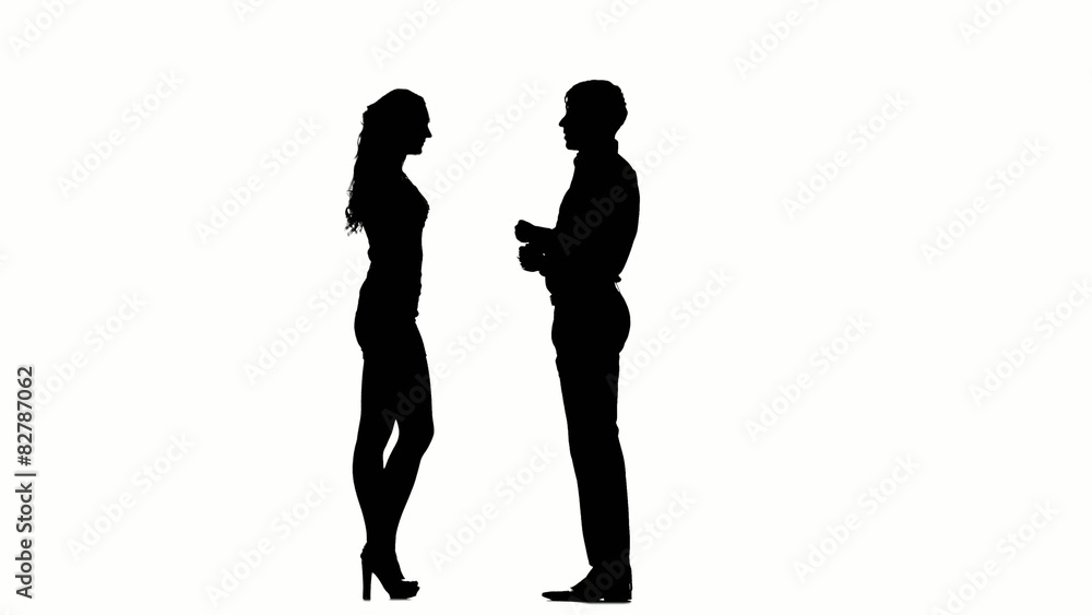 Silhouette of man kissing woman's hand. Silhouette of man kissing woman's hand.
