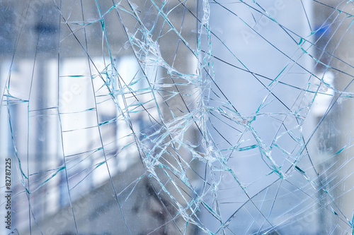 Cracked glass in a shop window closeup