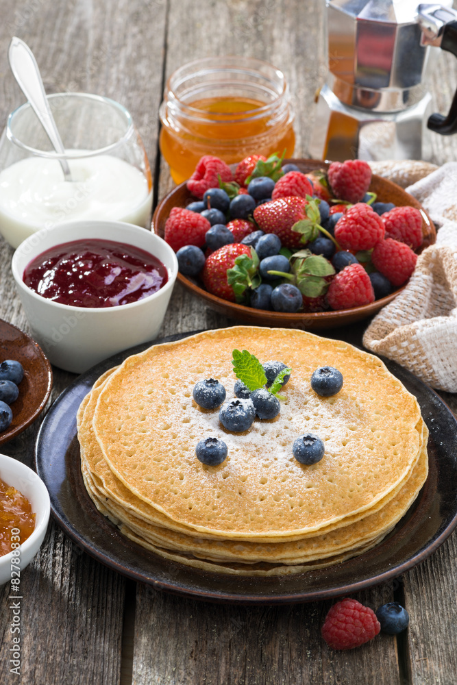crepes, fresh berries and jams, vertical crepes, fresh berries and jams, vertical