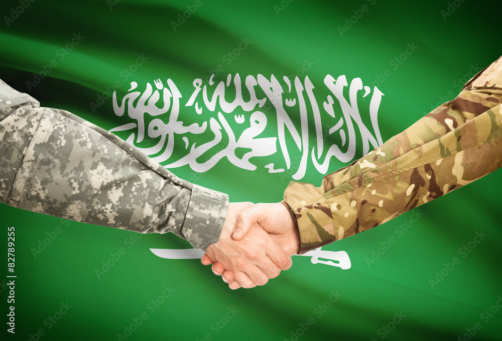 Men in uniform shaking hands with flag - Saudi Arabia