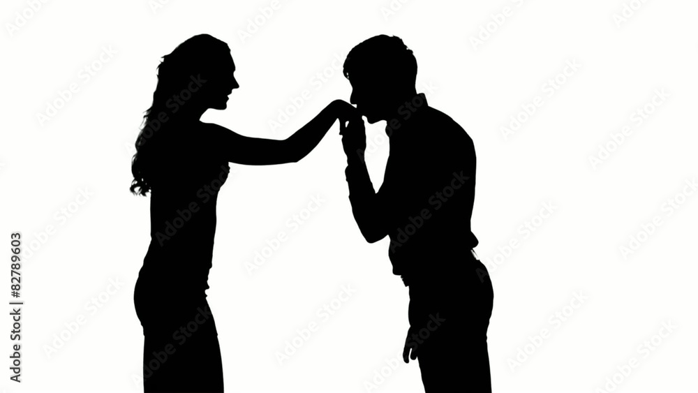 Silhouette of man kissing woman's hand. Slow motion. Close up Silhouette of man kissing woman's hand. Slow motion. Close up
