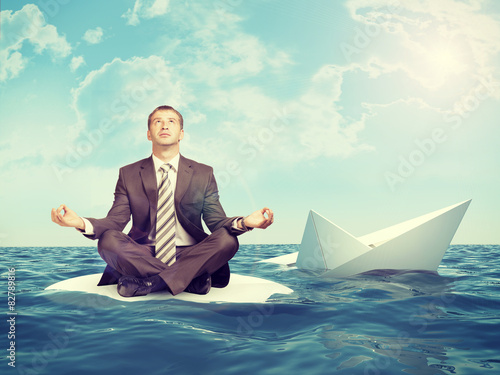 Fotografie Businessman with sinking ship
