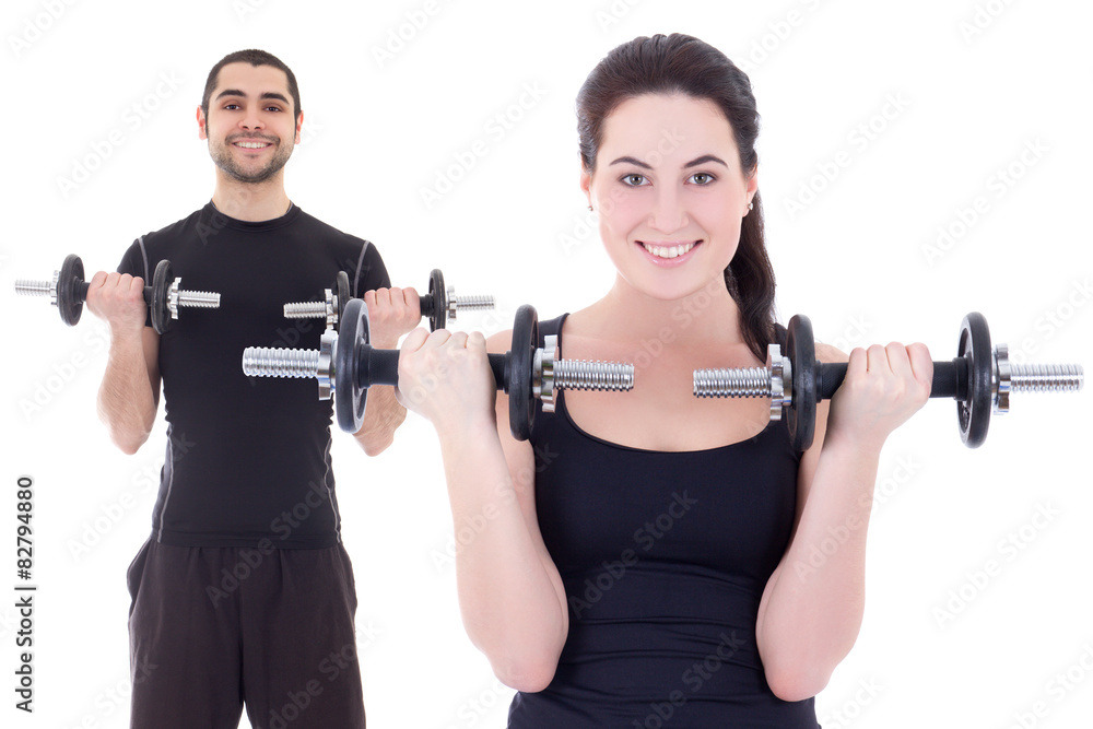 young attractive woman and man doing exercises with dumbbells is young attractive woman and man doing exercises with dumbbells is