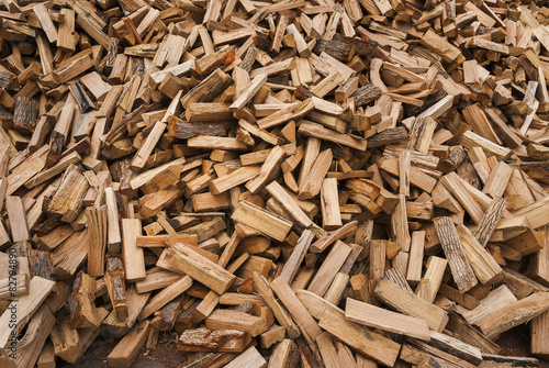 Pile of split fire wood prepared for winter burning