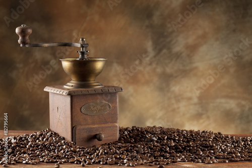 Coffee grains and old coffee grinder