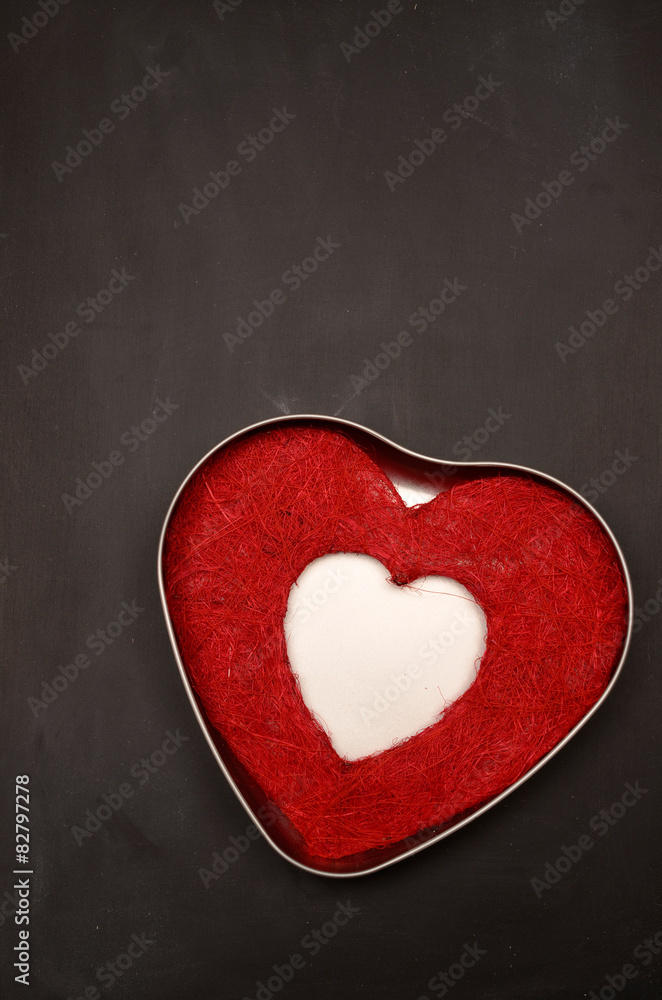Fototapeta premium Loving background with a red heart shape