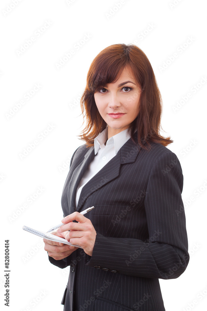 Senior businesswoman writing notes, smiling and looking at Senior businesswoman writing notes, smiling and looking at