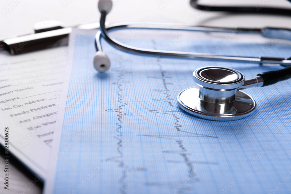 Cardiogram with stethoscope on table, closeup Cardiogram with stethoscope on table, closeup