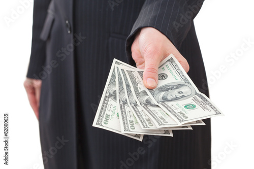 Businesswoman holding dollars close-up