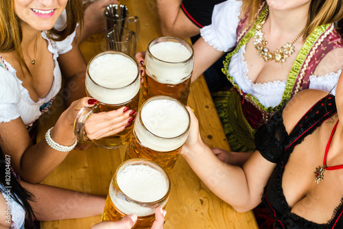 Bavarian girls drinking beer photo