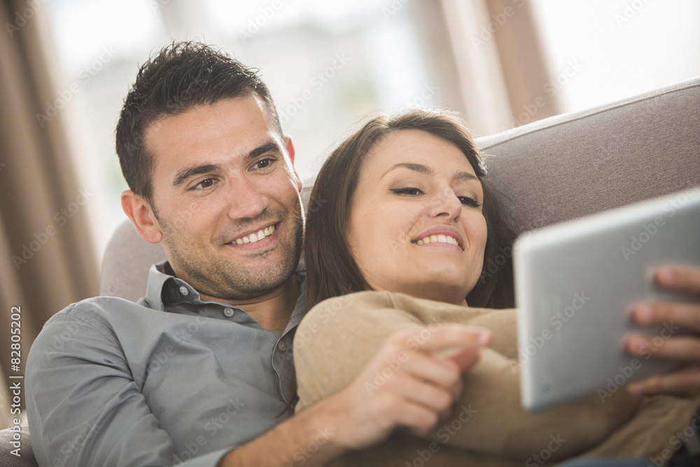 Happy couple using a tablet Happy couple using a tablet