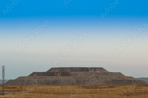 Industrial pyramid of earth extracted in the quarry. 