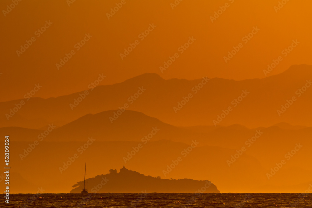 Sailing yacht on a cruise at sunrise