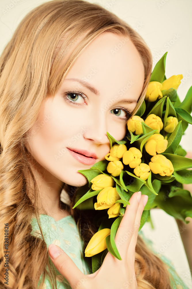 Natural Blond Beauty. Woman with Yellow Tulip Flowers Natural Blond Beauty. Woman with Yellow Tulip Flowers