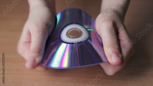 Young Woman Breaking CD, DVD photo