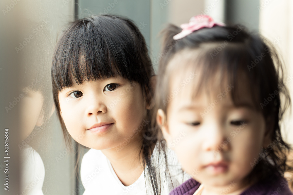 Portrait of Thai sister healthy young girl kid smiling at camera Portrait of Thai sister healthy young girl kid smiling at camera