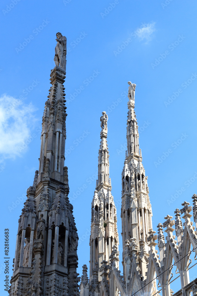 Statues on Milan Cathedral and blue sky