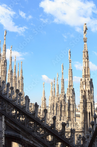 Statues on Milan Cathedral and blue sky