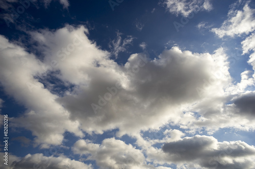 Blue sky with cumulus clouds.