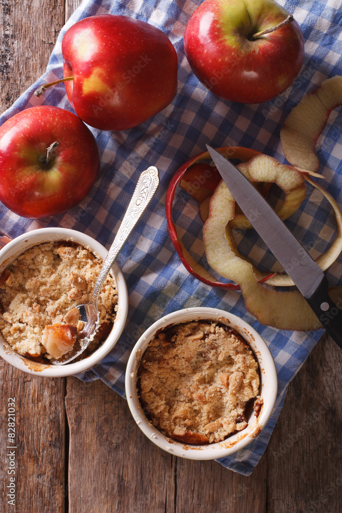 apple crumble in pots vertical top view of rustic style
apple crumble in pots vertical top view of rustic style