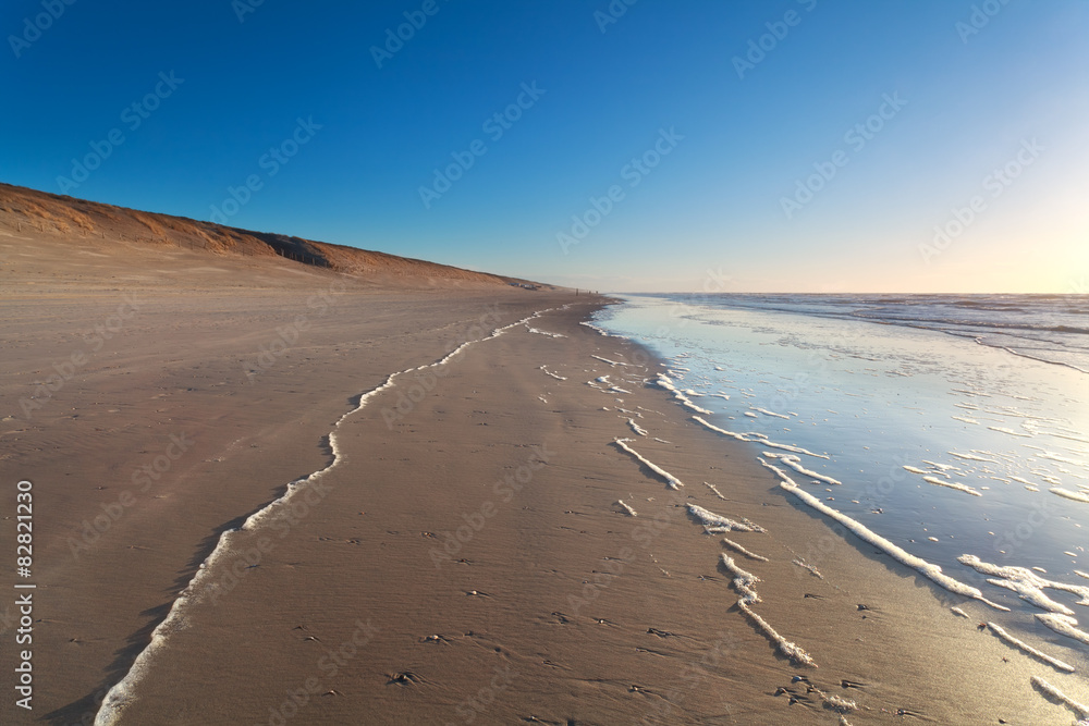 sand beach and North sea waves