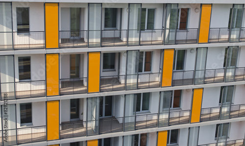Detail of a residential building with apartments in foreground.