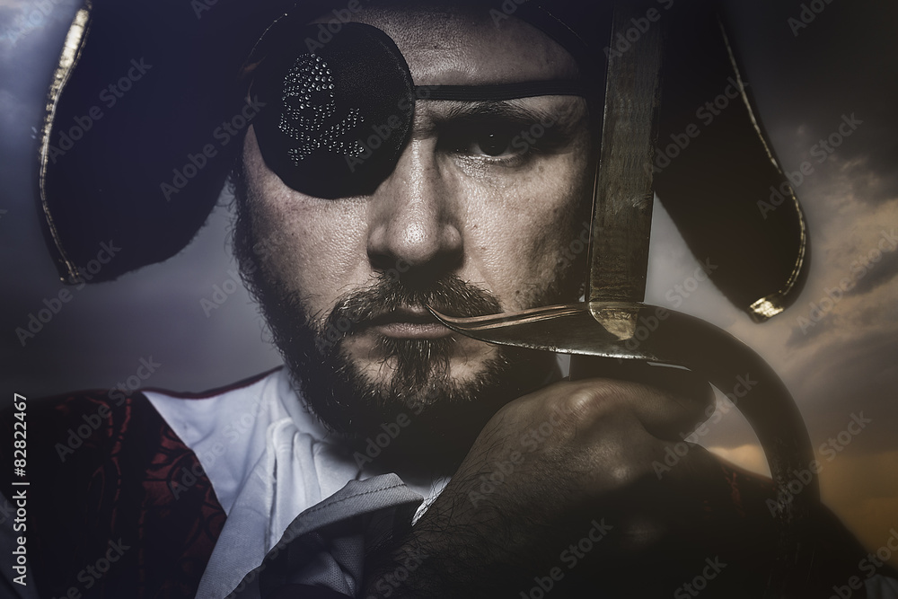 pirate with hat and eye patch holding a sword - obrazy, fototapety, plakaty 
