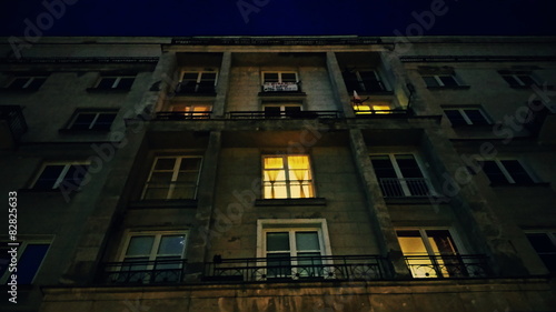 Building or house with lighting windows at evening or night © xmagics