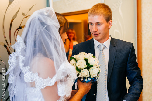 Handsome groom first time meets his bride at her house on a