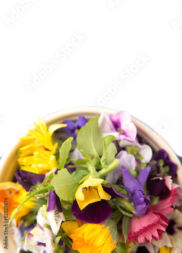 Mix edible flower salad in a blue single pot © akulamatiau