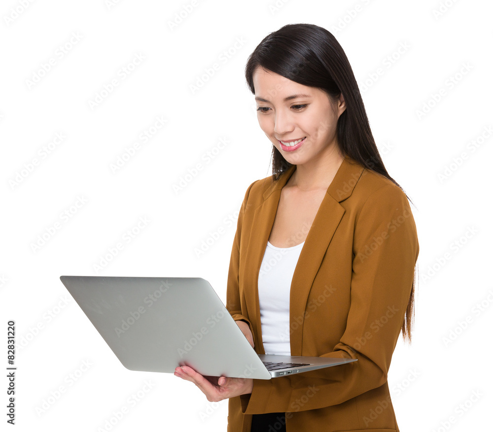 Businesswoman look at the laptop computer Businesswoman look at the laptop computer